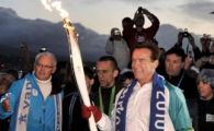 FOTO / Nebunie la Vancouver! Arnold a purtat flacara olimpica prin centrul orasului
