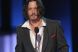 Johnny Depp, muscat de cainele lui Brad Pitt!